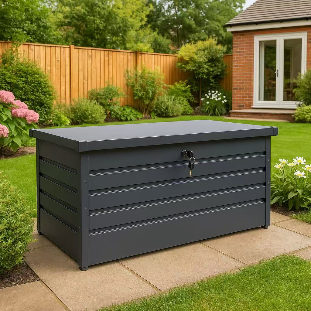 Lockable black metal outdoor storage box in a garden